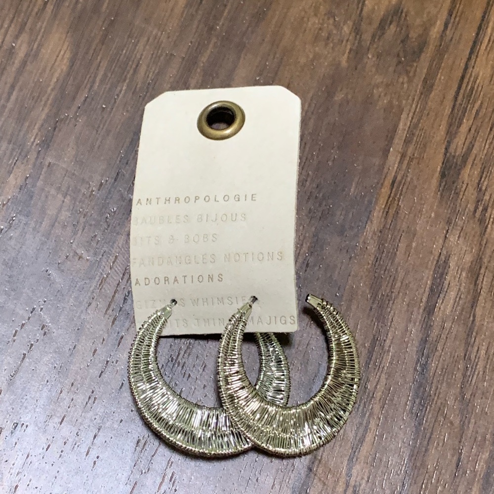 Anthropologie Wrapped crescent hoop earring